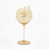 Interior Boulevard Athena ware wine glass Side view of a handblown wine glass with sophisticated design and amber finishing.